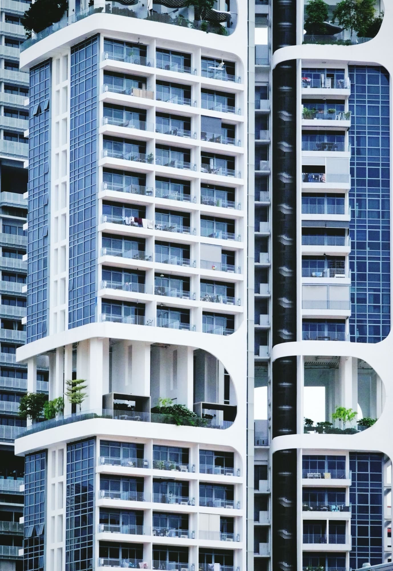 Modern private condominium glass facade with balconies in Singapore